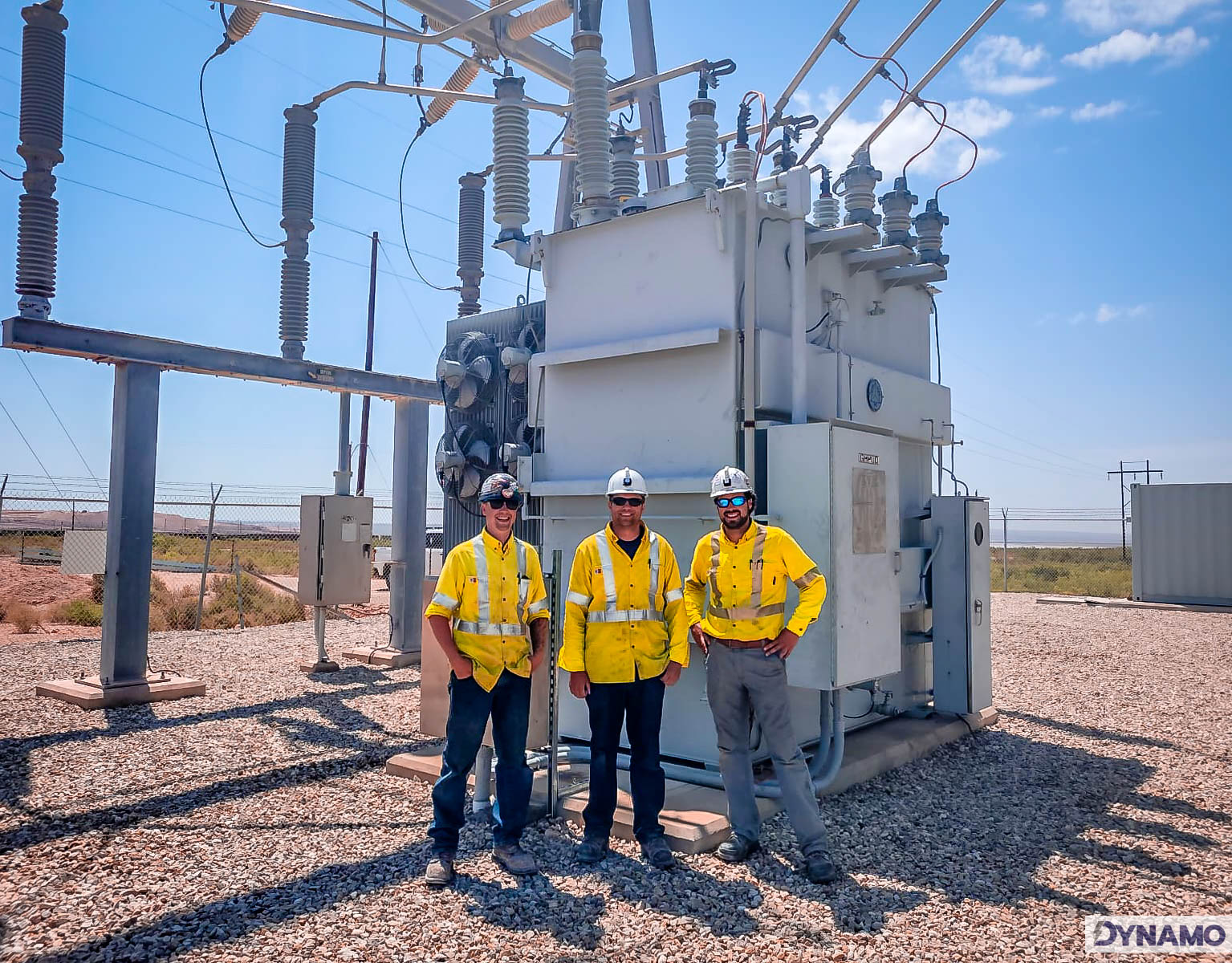 Dynamo Crew standing in front of installed transformer - Carlsbad